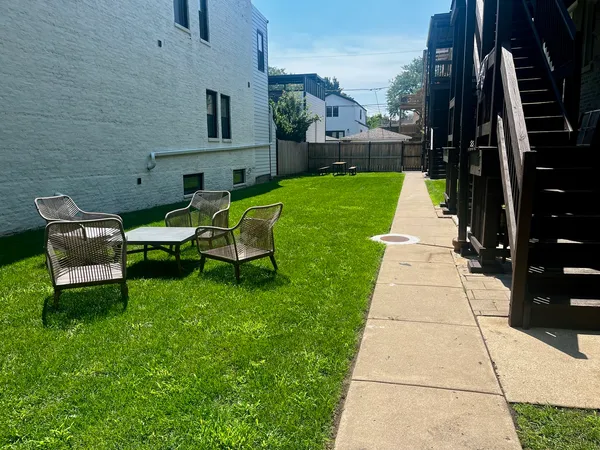 a view of a patio with a yard