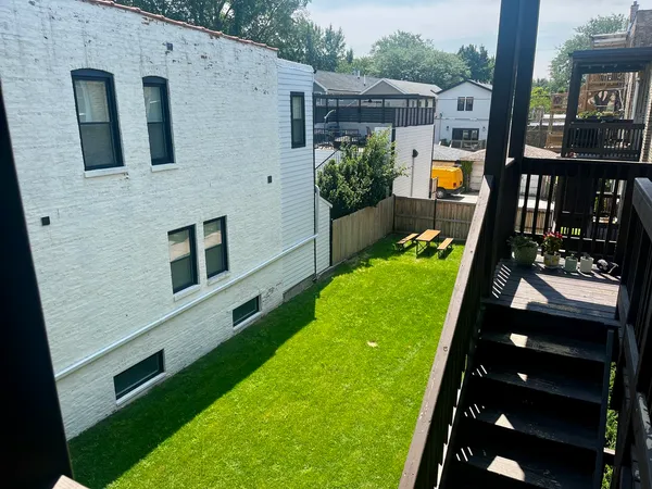 a backyard of a house with lots of green space