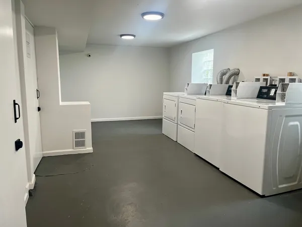 a room with a sink and a mirror