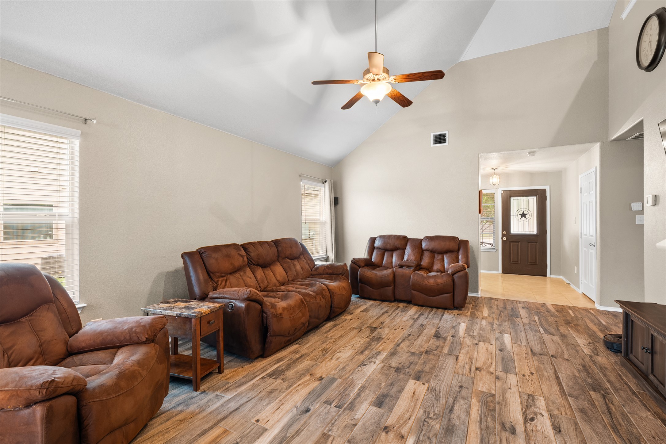 137 Barn Owl Loop Leander, TX 78641 - Photo 10 of 36 a living room with furniture and a chandelier