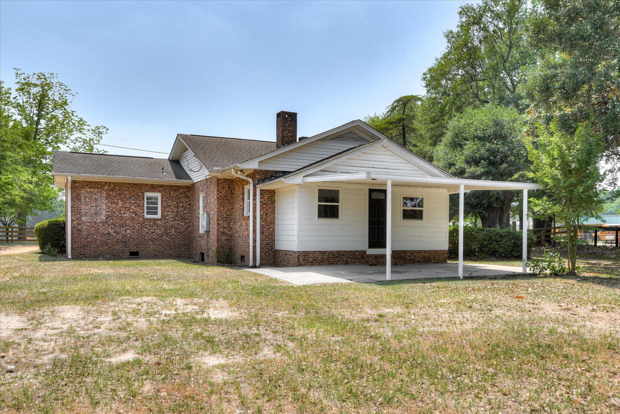 126 Mosley Road Aiken, SC 29801 - Photo 25 of 29 a house with yard in front of it