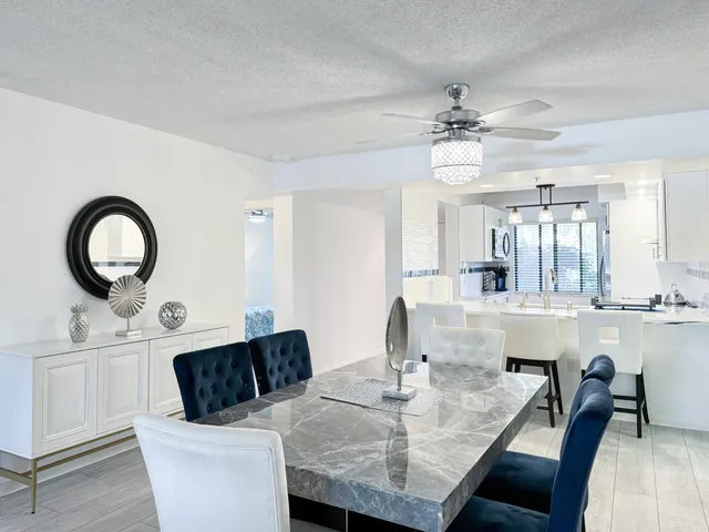 a kitchen with a table chairs and a stove