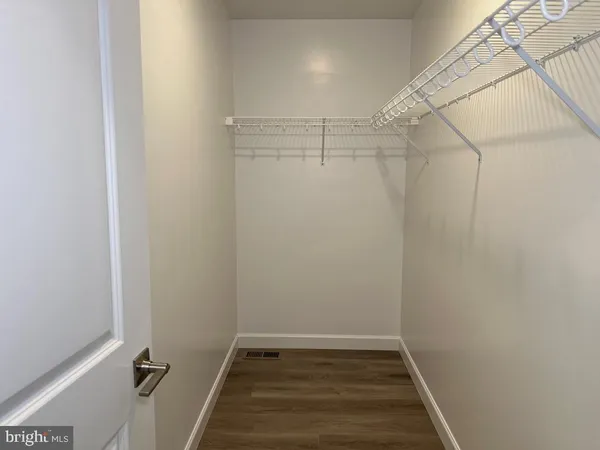 a view of a room with racks on the wall
