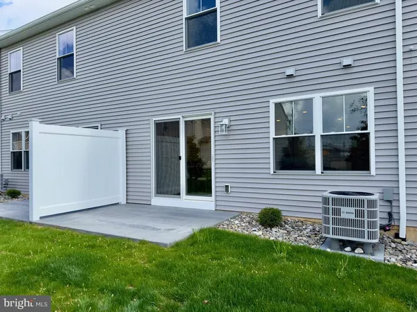 a view of backyard with a garden and entertaining space