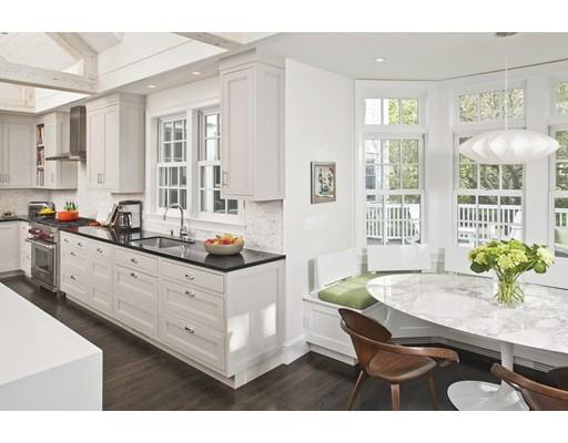 3 Alexandra Way Hingham, MA 02043 - Photo 5 of 30 a kitchen with granite countertop a table chairs sink and cabinets