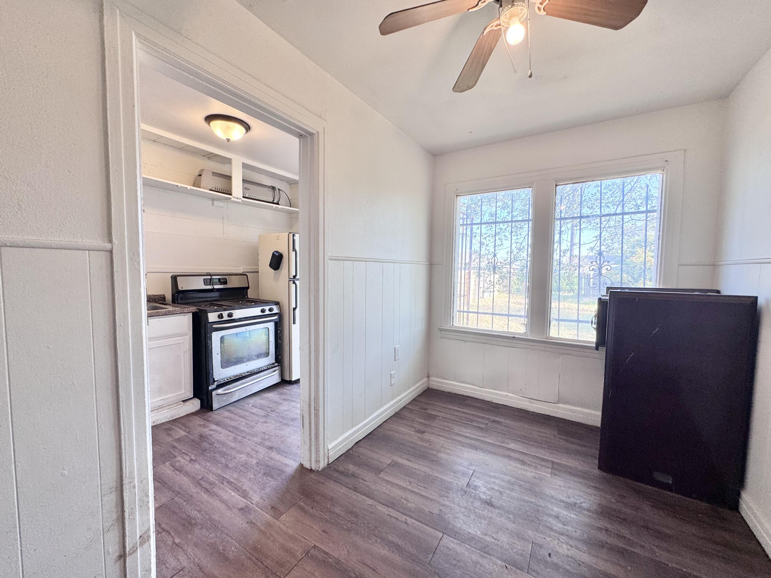 2912 Amherst Street Lubbock, TX 79415 - Photo 6 of 10 a kitchen with a refrigerator and a stove top oven
