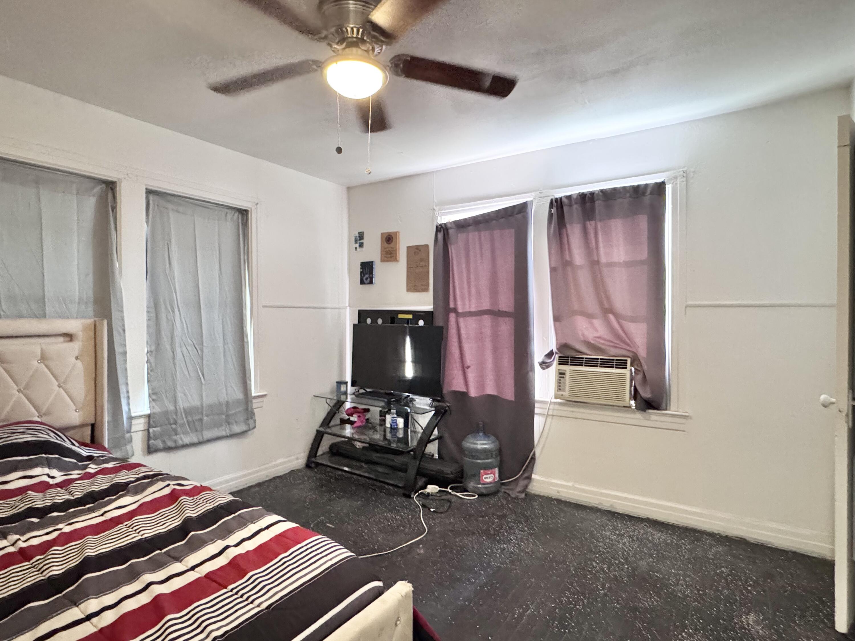 2912 Amherst Street Lubbock, TX 79415 - Photo 9 of 10 a bedroom with bed and a window