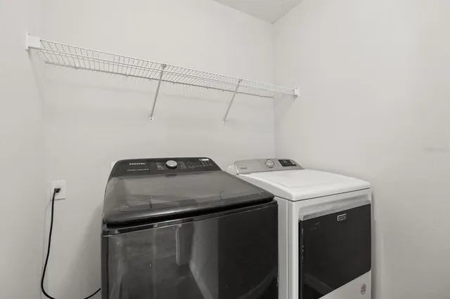 a utility room with dryer and washer
