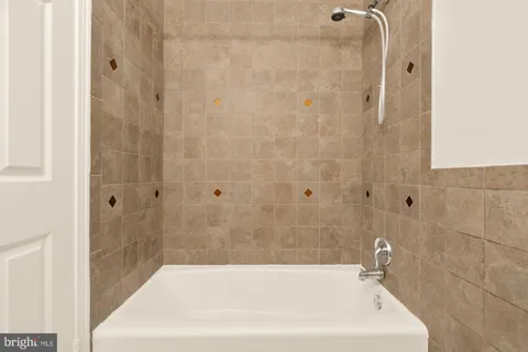 a bathroom with a white bath tub