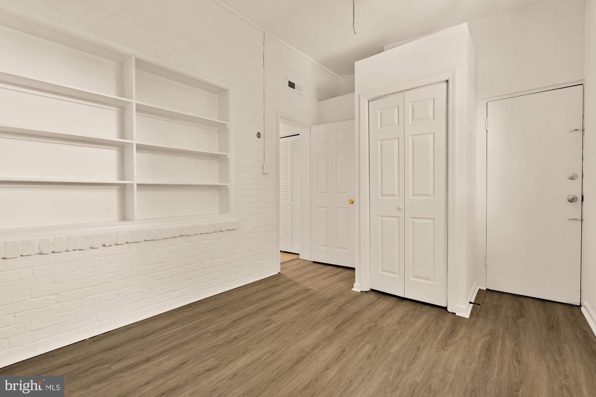 1254 Simms Place Northeast Washington, DC 20002 - Photo 17 of 21 a view of an empty room with wooden floor