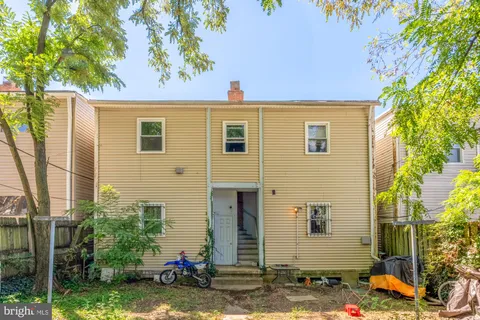 a front view of a house with yard