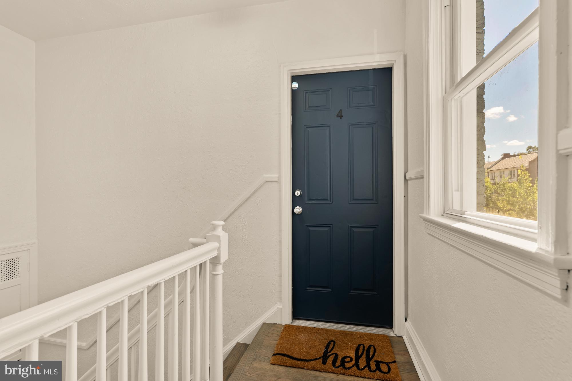 1254 Simms Place Northeast Washington, DC 20002 - Photo 5 of 21 a view of a bedroom with a wooden door