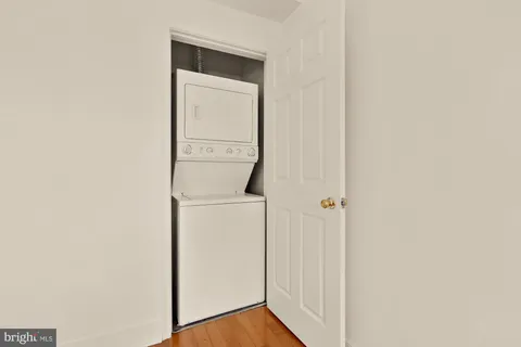 a view of a storage and utility room with washer and dryer