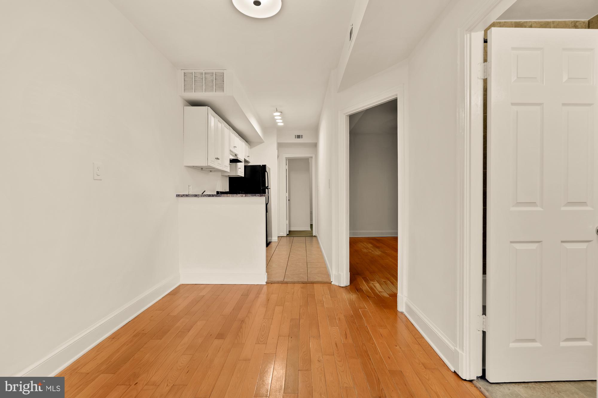 1254 Simms Place Northeast Washington, DC 20002 - Photo 9 of 21 a view of empty room with wooden floor