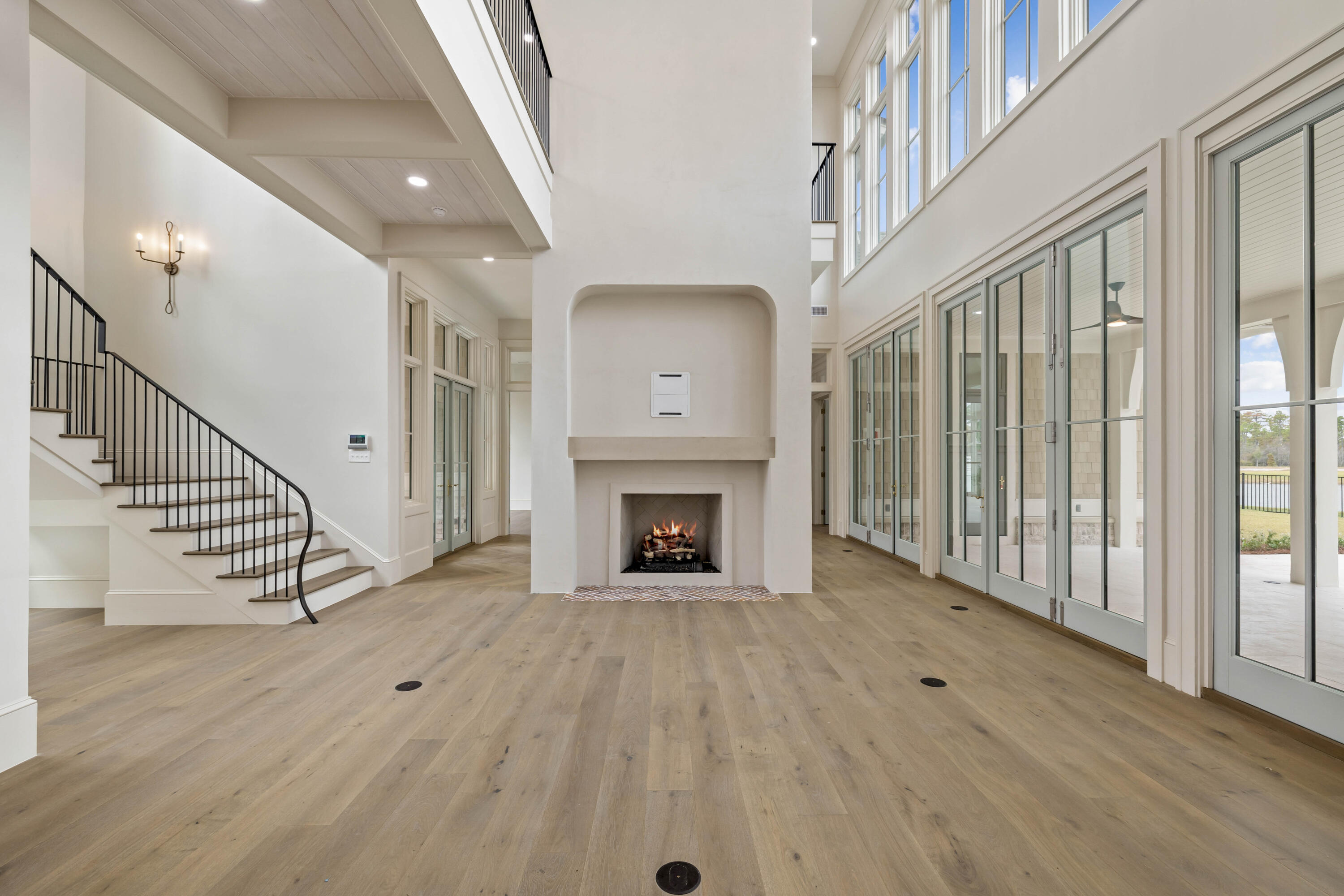 99 Morning Light Way Inlet Beach Inlet Beach, FL 32461 - Photo 7 of 97 a view of an empty room with wooden floor fireplace and a window