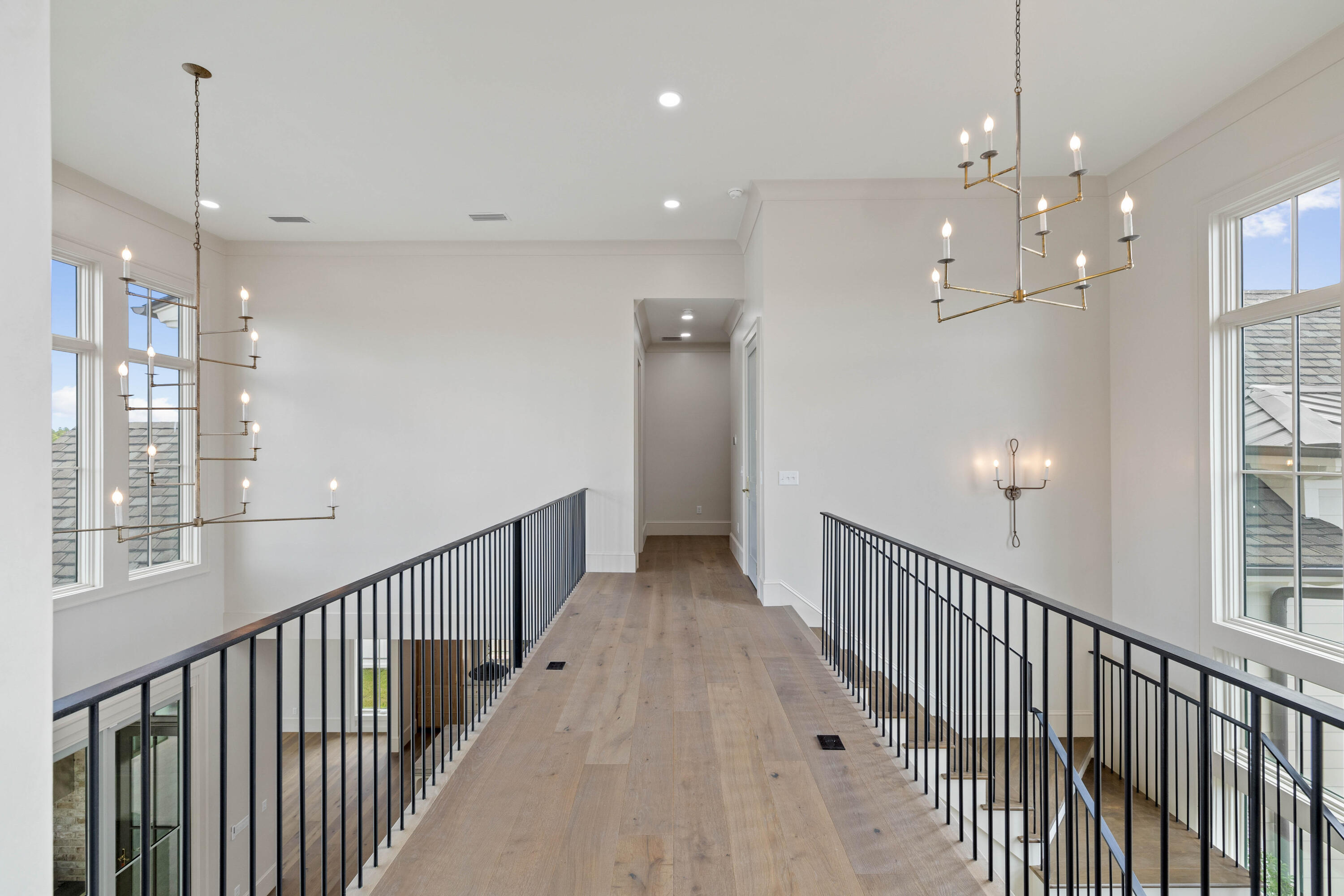 99 Morning Light Way Inlet Beach Inlet Beach, FL 32461 - Photo 71 of 97 a view of a hallway with chandelier fan and a dining table