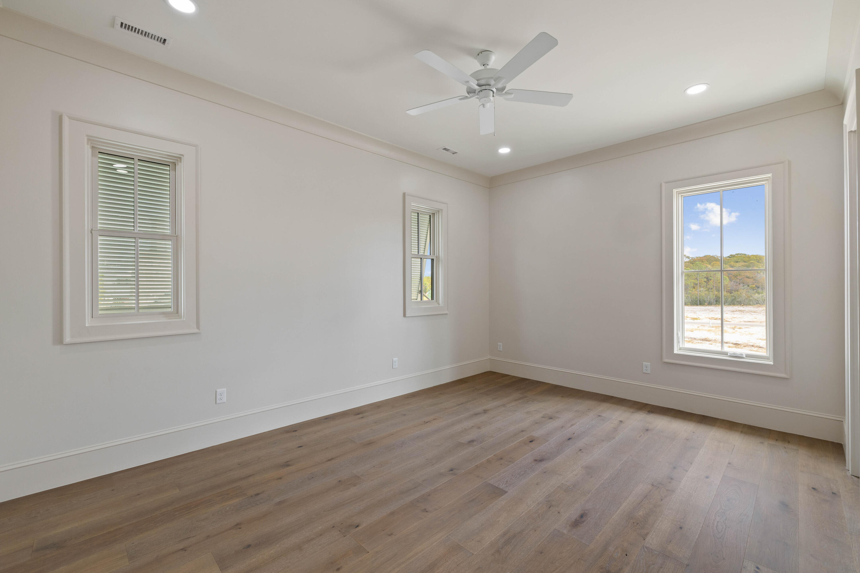 99 Morning Light Way Inlet Beach Inlet Beach, FL 32461 - Photo 83 of 97 a view of an empty room with a window and wooden floor
