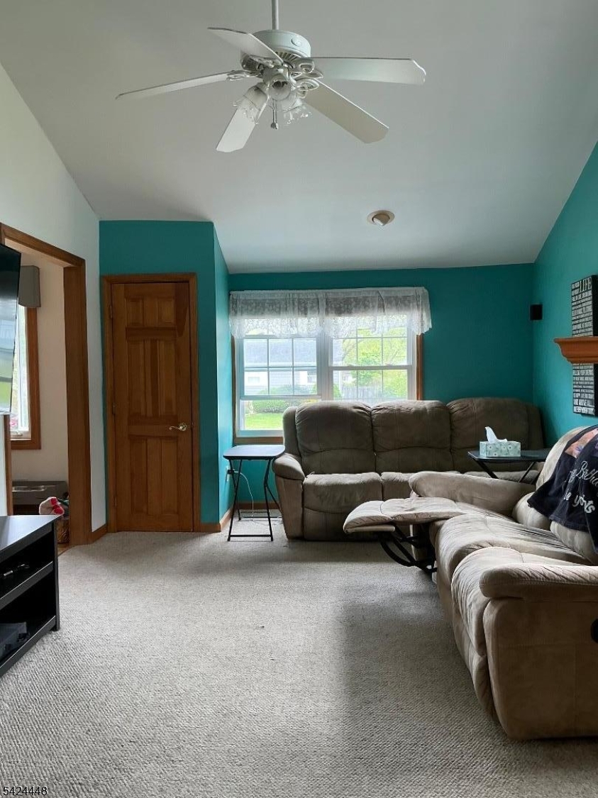 20 Nottingham Drive Howell, NJ 07731 - Photo 7 of 21 a living room with furniture and a window