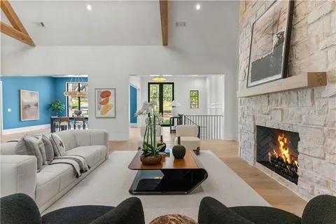 a bathroom with double sink and a window