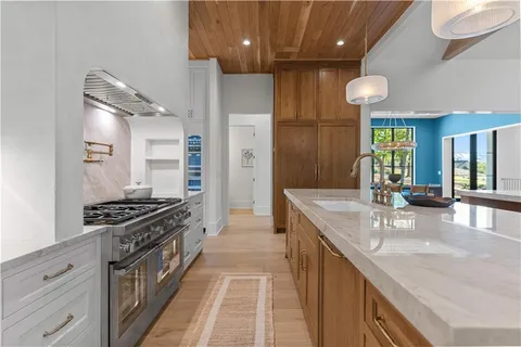 a view of a livingroom with furniture and windows