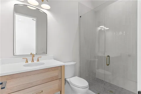 a view of an empty room with a fireplace and a window