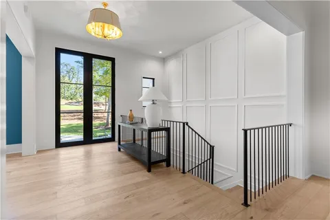 a view of a dining room with furniture wooden floor and chandelier