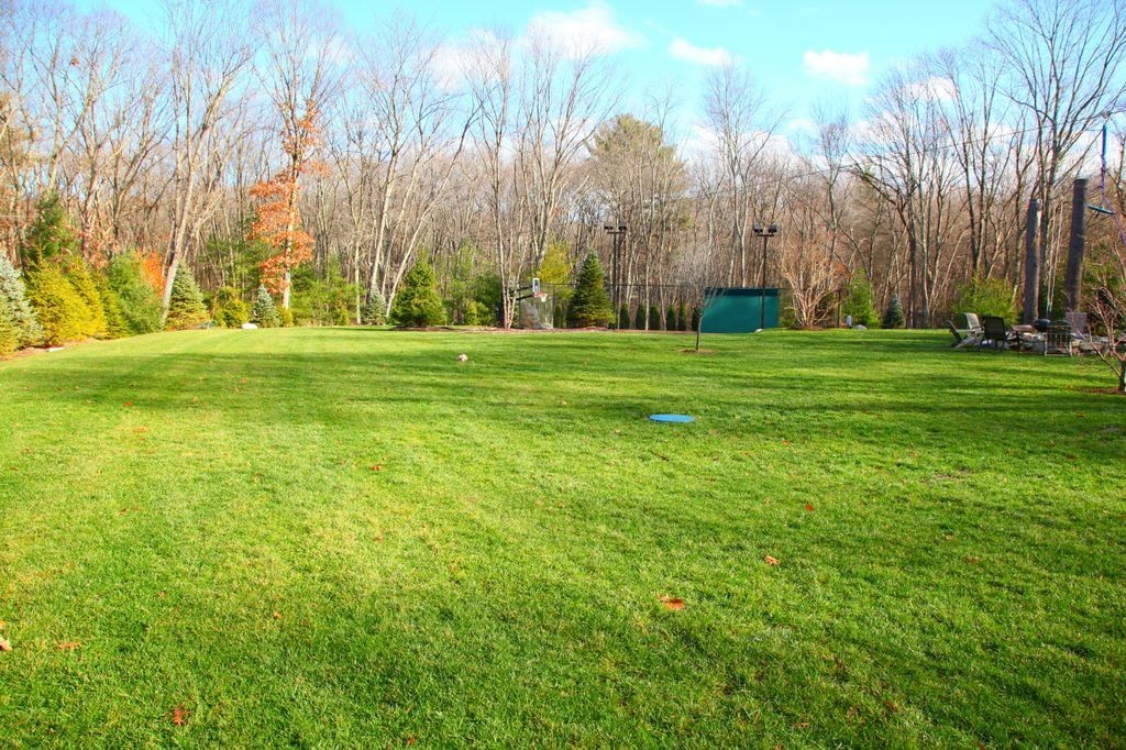 158 Beaver Road Weston, MA 02493 - Photo 2 of 12 a view of a field of grass and trees