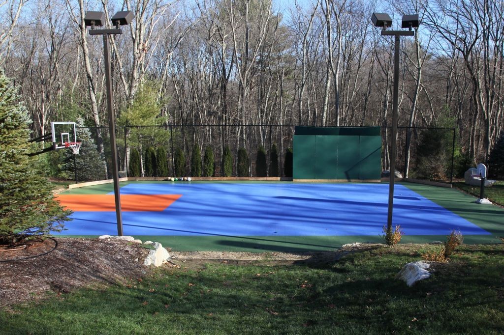 158 Beaver Road Weston, MA 02493 - Photo 5 of 12 a view of a tennis ground with large trees