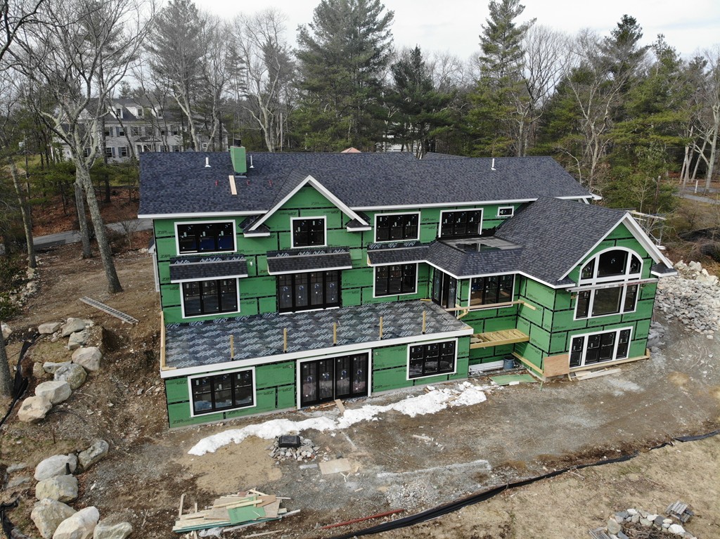 158 Beaver Road Weston, MA 02493 - Photo 10 of 12 a front view of a house with garden