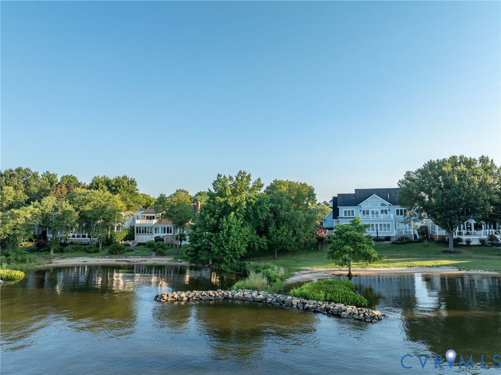 1540 Harbor Road Williamsburg, VA 23185 - Photo 23 of 50 a view of a lake with a house in the background