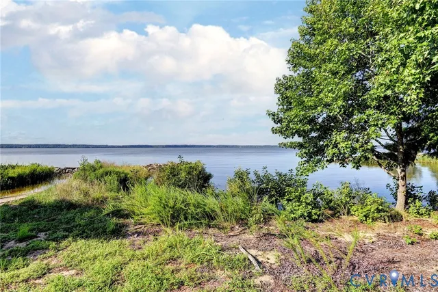 an aerial view of a houses with a yard