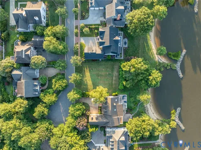 an aerial view of residential house with outdoor space and swimming pool