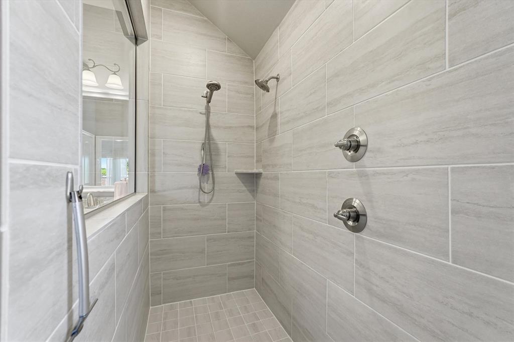 813 Mildren Lane Fate, TX 75087 - Photo 14 of 32 This dreamy, over-sized shower includes 2 shower heads and is more than spacious for two people to use at the same time!