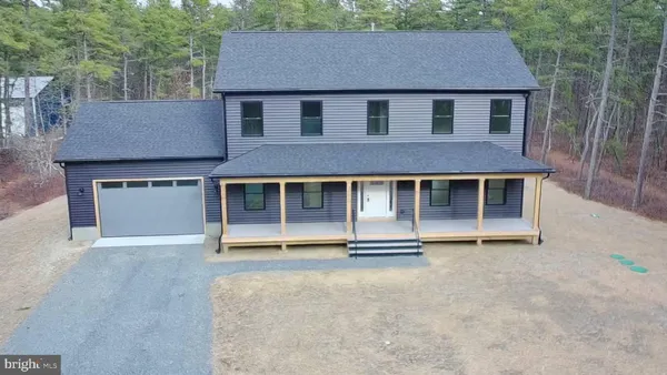 front view of a house with a garden
