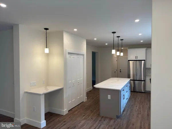 a large room with a table and chairs