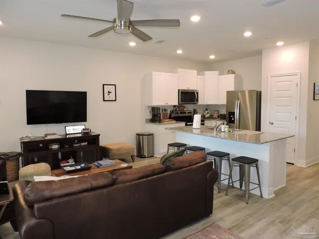 a bedroom with a bed and glass window
