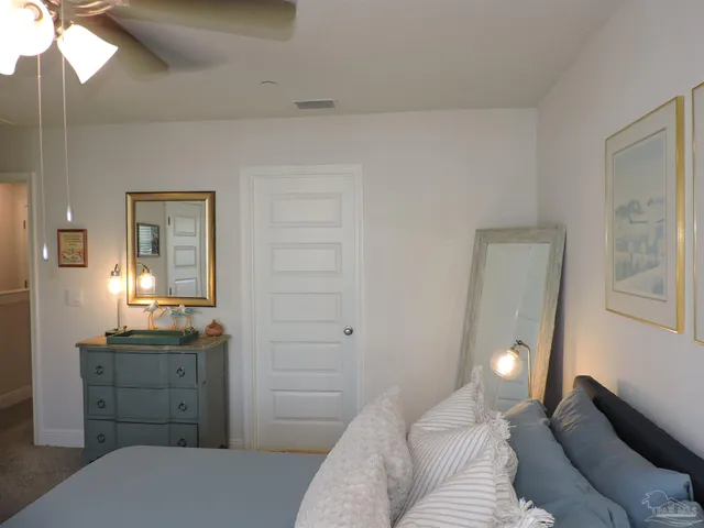 a view of room with a window and a chandelier fan