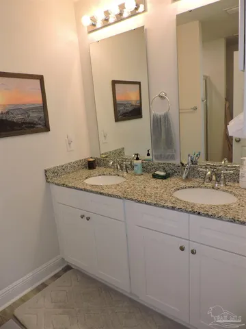 a white toilet sitting next to a bathroom sink
