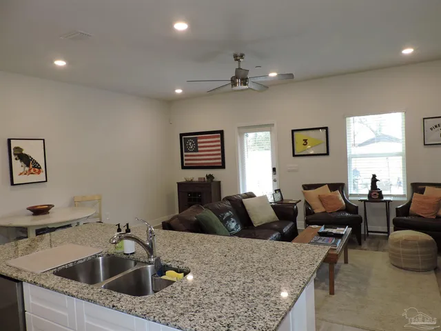 a large kitchen with a table and chairs