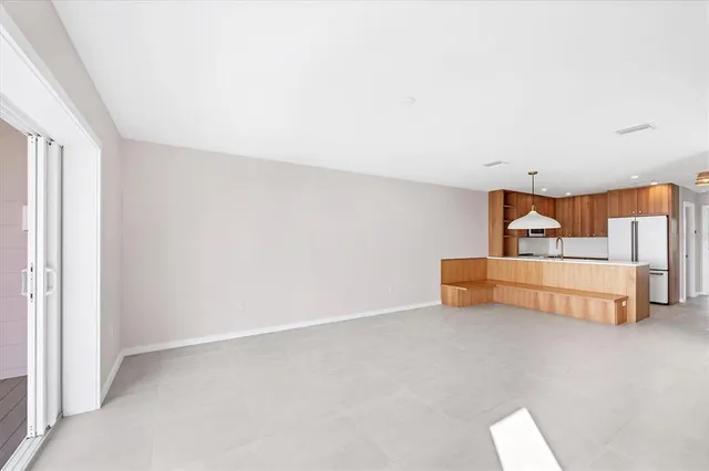 a room with a bed and cabinets