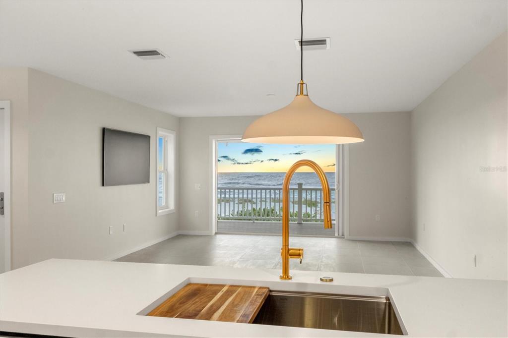 290 Gulf Boulevard, Unit 18 Boca Grande, FL 33921 - Photo 22 of 49 a kitchen with a sink and a window