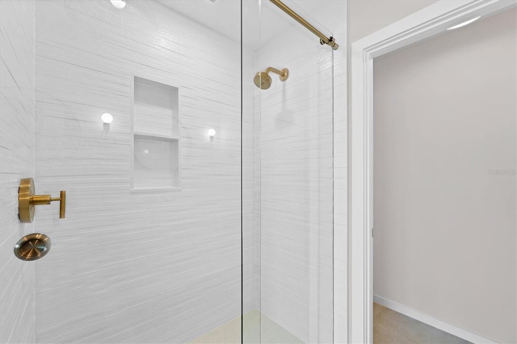 290 Gulf Boulevard, Unit 18 Boca Grande, FL 33921 - Photo 29 of 49 a bathroom with a shower and a sink