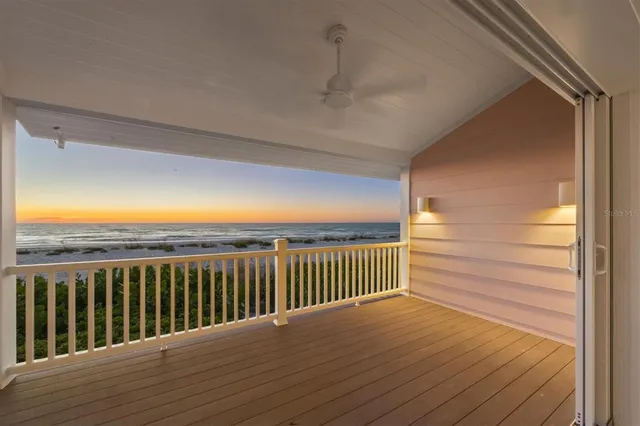 a view of a balcony with wooden floor