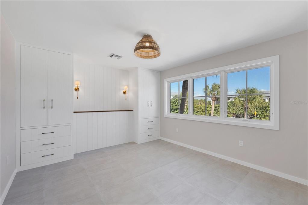 290 Gulf Boulevard, Unit 18 Boca Grande, FL 33921 - Photo 31 of 49 a view of an empty room with a window