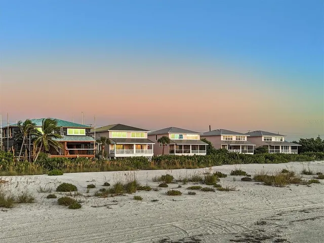 a view of multiple houses with a yard