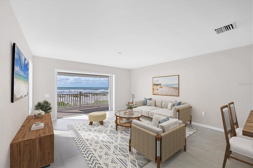 290 Gulf Boulevard, Unit 18 Boca Grande, FL 33921 - Photo 6 of 49 a living room with furniture and a large window