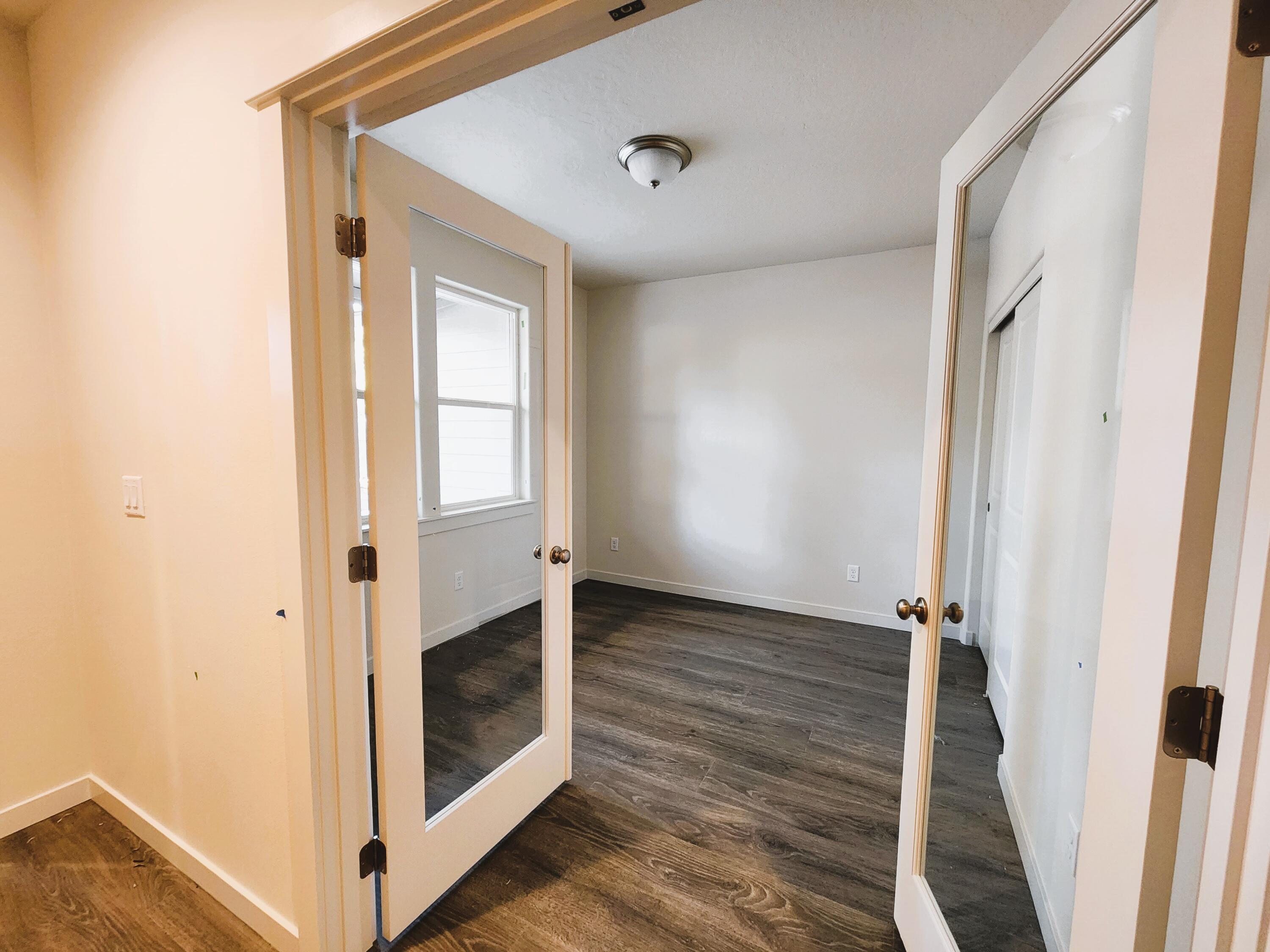 18867 Choctaw Road Bend, OR 97702 - Photo 6 of 22 French door entrance to the den and LVP flooring. This room does have a closet- possible 4th bedroom option.