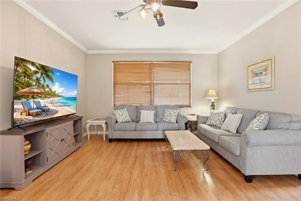 21524 Windham Run Estero, FL 33928 - Photo 11 of 50 a living room with furniture and a flat screen tv