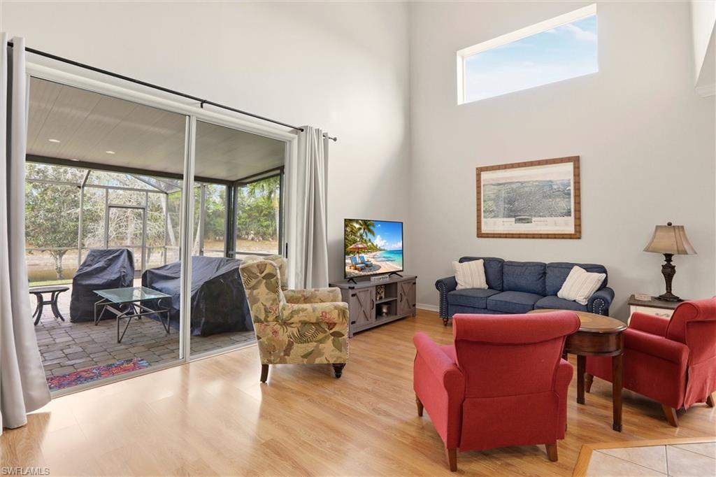 21524 Windham Run Estero, FL 33928 - Photo 13 of 50 a living room with furniture and a large window