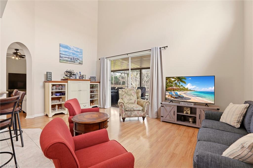 21524 Windham Run Estero, FL 33928 - Photo 14 of 50 a living room with furniture flat screen tv and a large window